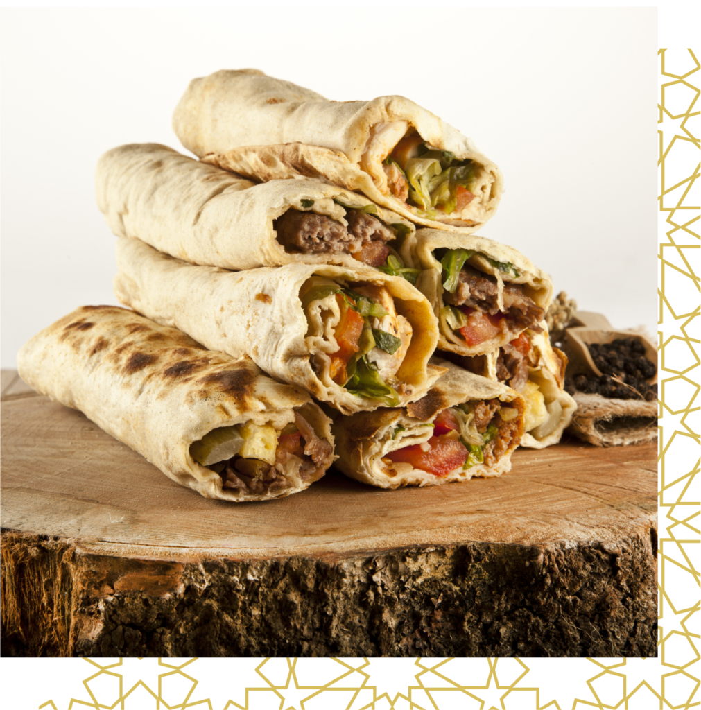 Image of stacked delicious beef and chicken shawarma wraps. Corporate Catering in Toronto